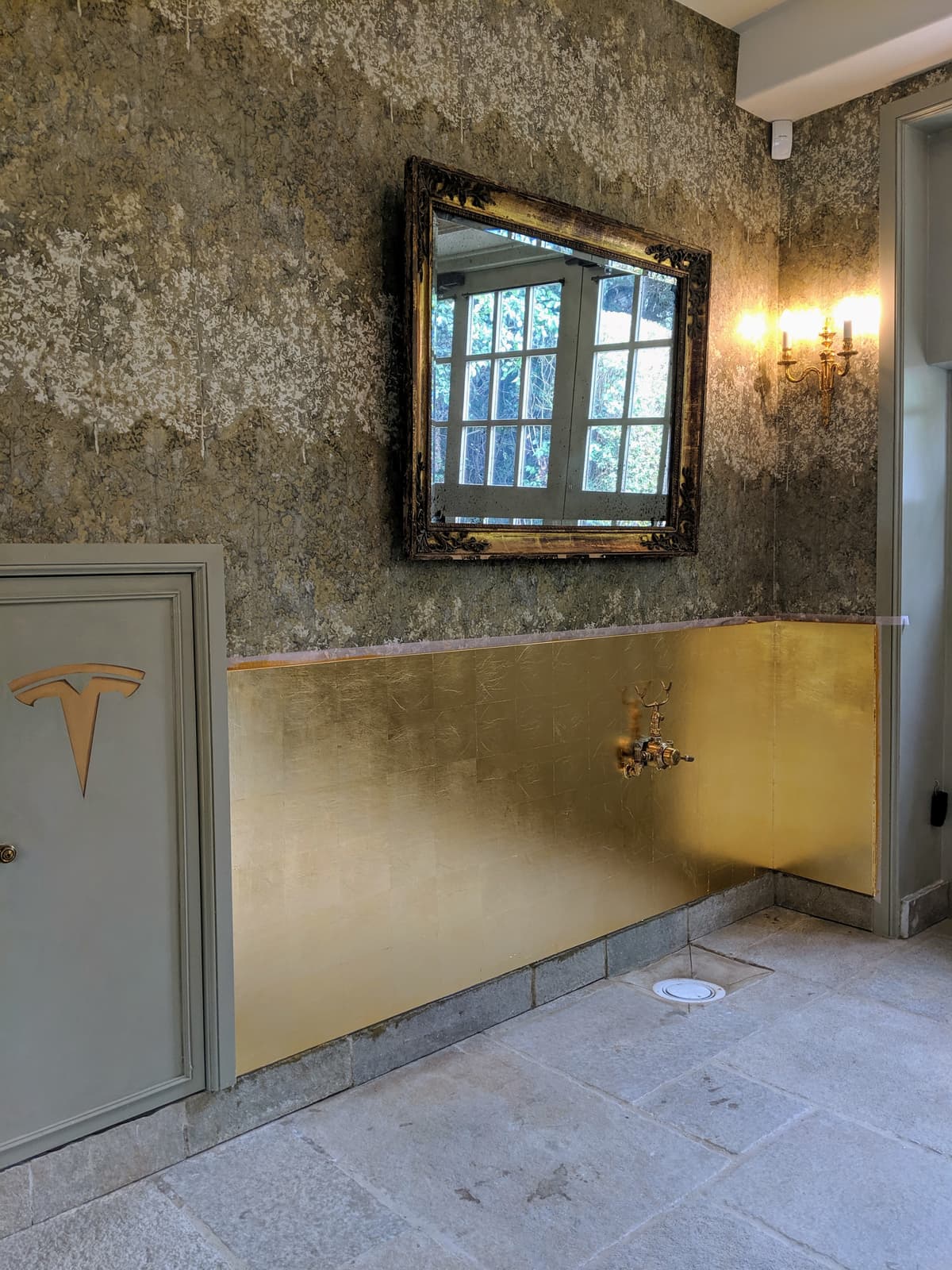 Handcrafted bespoke mirror with antique finish in modern UK home interior